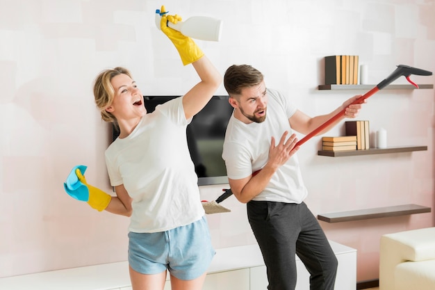 Photo couple indoors ready to clean the house