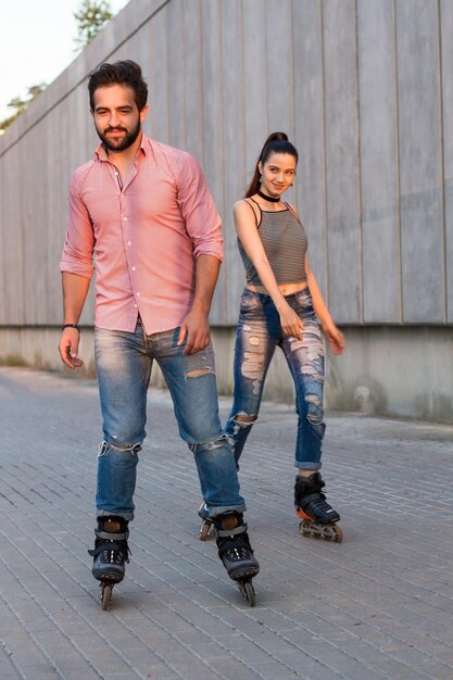 Couple inline skating young man and woman good idea for active date