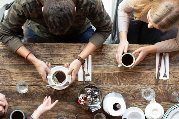 Couple is drinking coffee in a restaurant