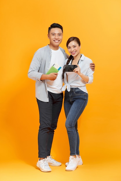 A couple isolated over a yellow color background