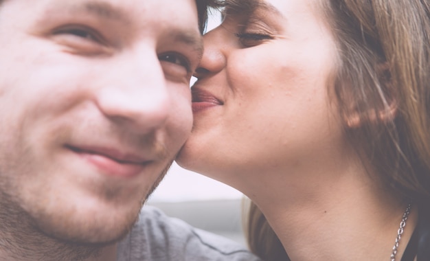 Couple kiss close up