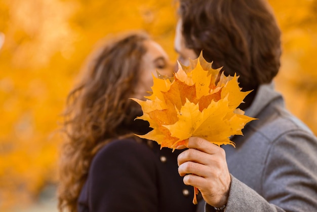 couple kissing in autumn park