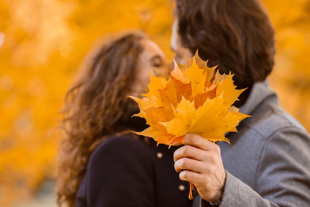 Couple kissing in autumn park