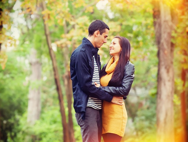 Couple kissing outdoor in the park