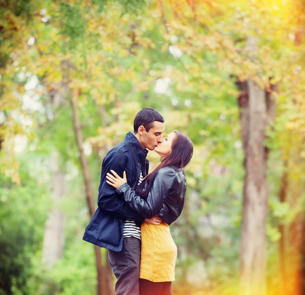 Couple kissing outdoor in the park