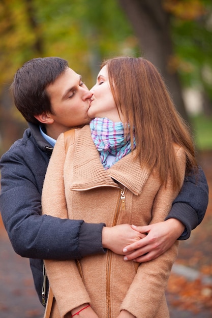 Couple kissing outdoor in the park