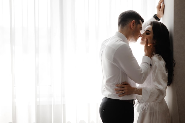 couple kissing portrait of a couple in love close portrait of a couple in love