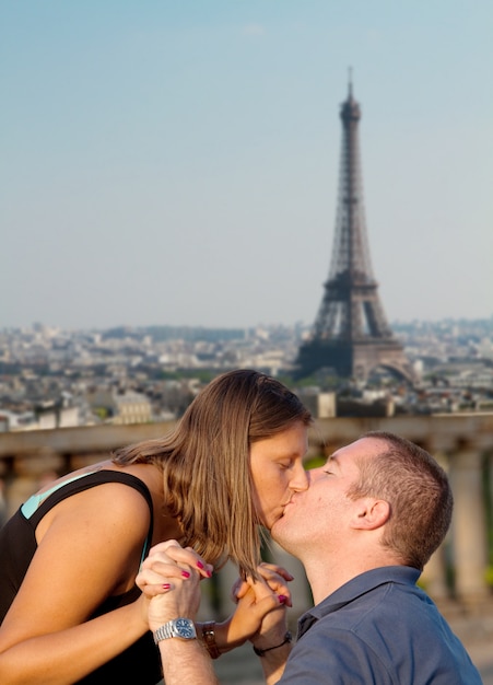 a couple kissing with Paris 