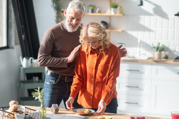 Couple in the kitchen preparing for a dinner