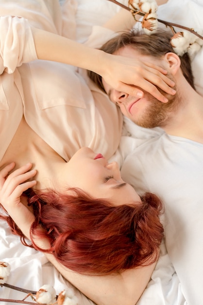 Couple laying on a bed