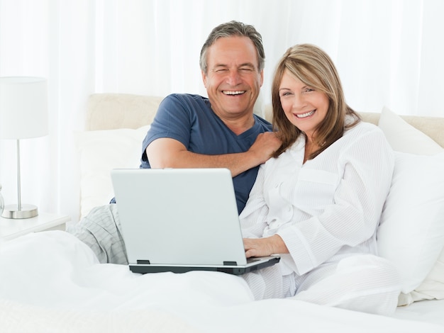 Couple looking at the camera at home