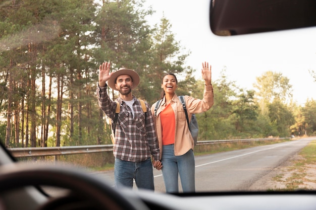 Photo couple looking for drive while traveling