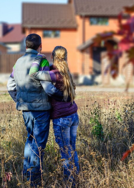 Couple looking on house