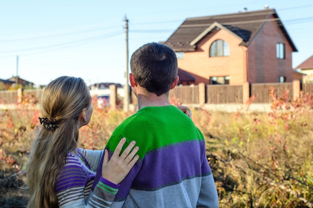 Couple looking on house