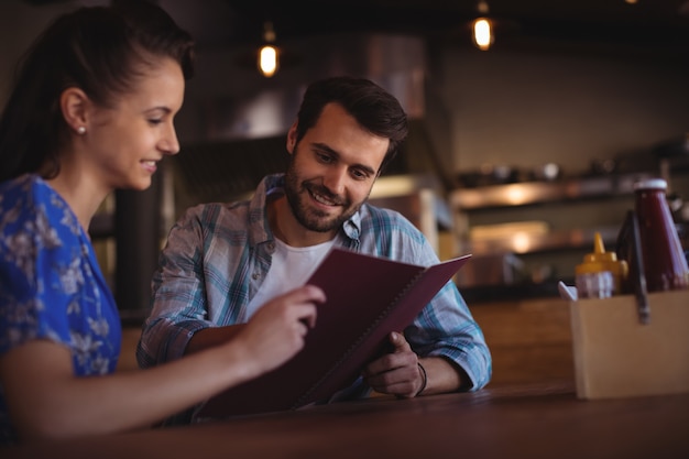 Couple looking at menu