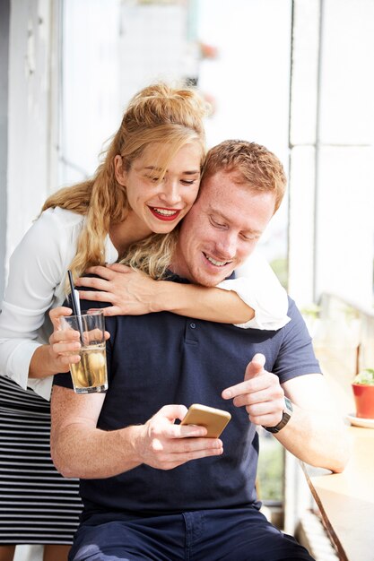 Couple looking at photos on phone