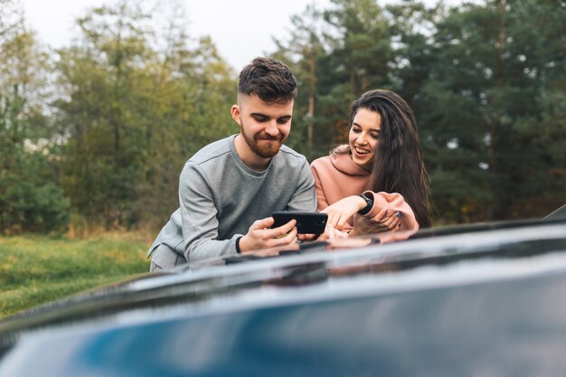 Couple looking at smartphone