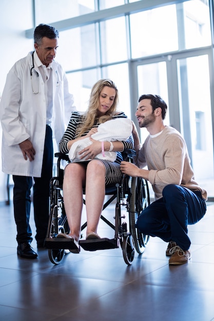 Couple looking at their newborn baby