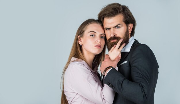 Couple in love of bearded man and sexy woman embrace romance