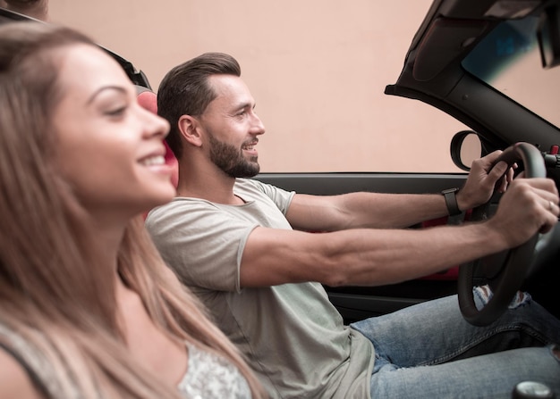 Couple in love in a convertible car