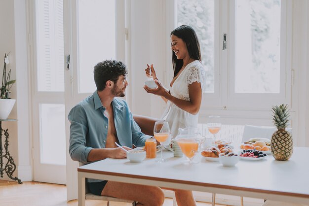 Couple in love eating breakfast in the morning