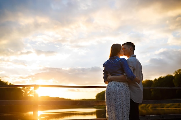 Couple in love enjoying tender moments during sunset