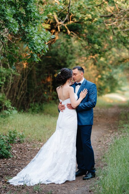 A couple in love a guy and a girl on a walk in the forest belt