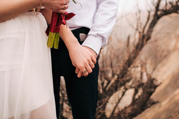 Couple in love hold each other's hands