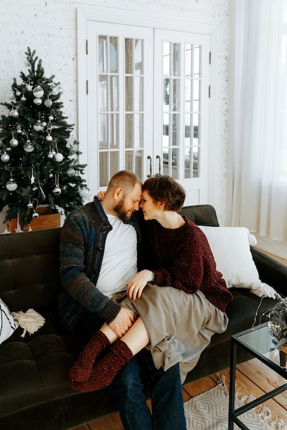 couple in love at home on Christmas time