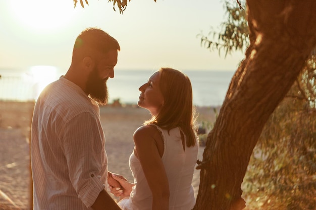 Couple in love hugs man and woman smiling travel by sea