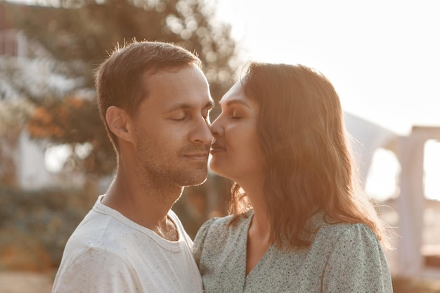 Photo couple in love hugs man and woman smiling valentines day