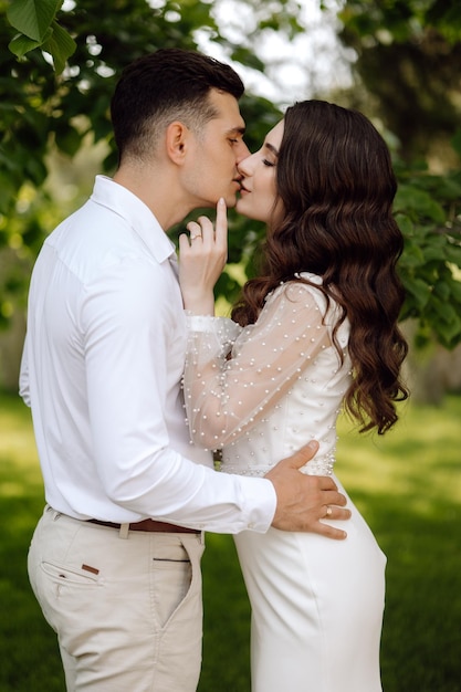 A couple in love kissing in the park