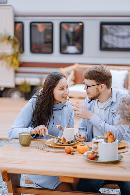 Couple in love living in trailer on camping and have fun and happy