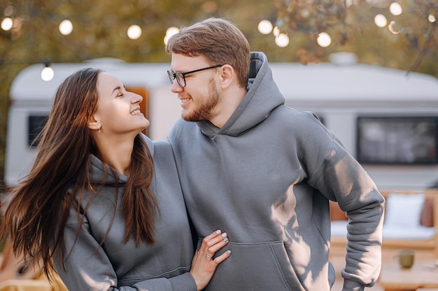 Couple in love living in trailer on camping and have fun and happy