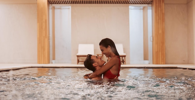 Couple in love at luxury Hotel Spa and pool