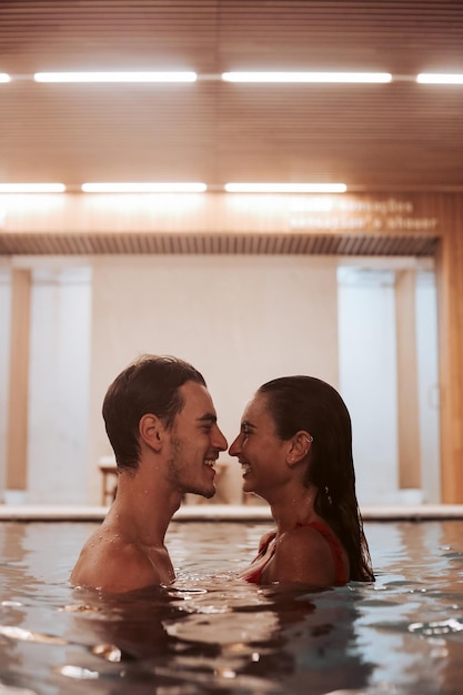 Couple in love at luxury Hotel Spa and pool