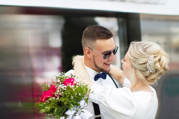 Couple in love man and woman bride and groom hug closeup