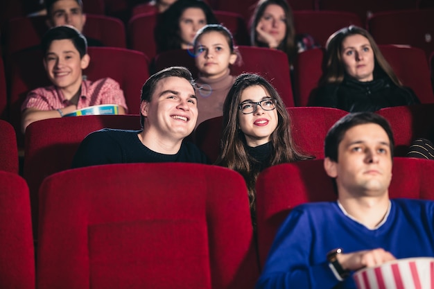 A couple in love in a movie theater