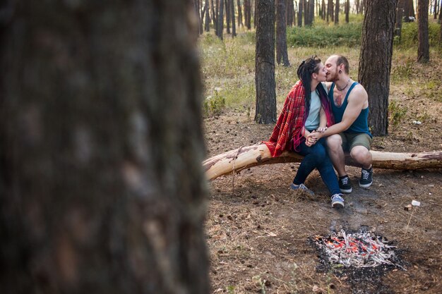 Couple love nature picnic bonfire forest concept. Happy family together.