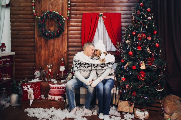 Couple in love in one scarf holding hands