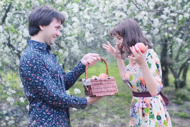 Couple in love outdoor apple tree picnic