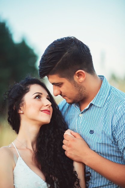 Couple in love outdoors in a field