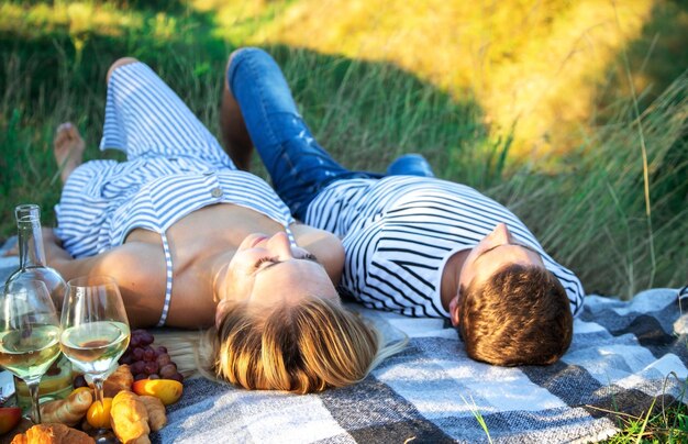 Couple in love on a picnic in the park. Nature. Selective focus