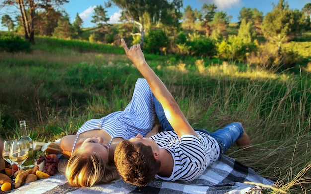 Couple in love on a picnic in the park Selective focus