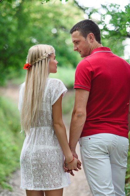 Couple in love at a picnic in a park with green grass