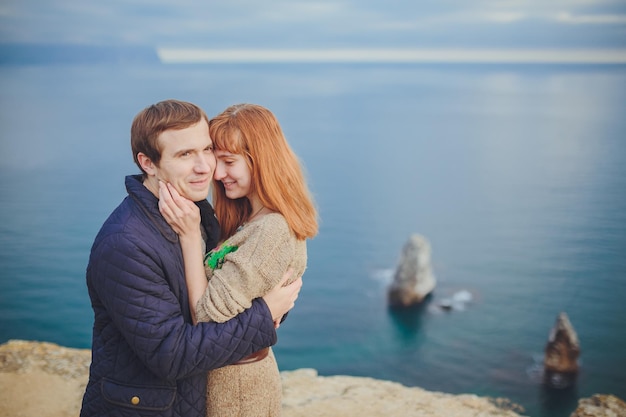 Couple in love relaxing mountain Coast