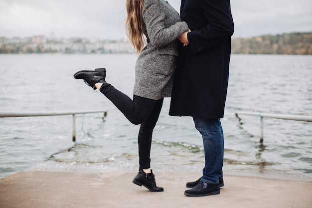 A couple in love on a romantic date near the lake