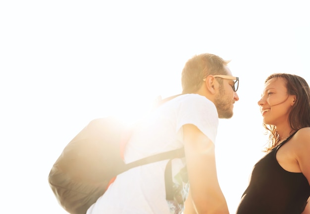 Couple in Love Sensual outdoors portrait of young stylish couple at summer day on sunlight