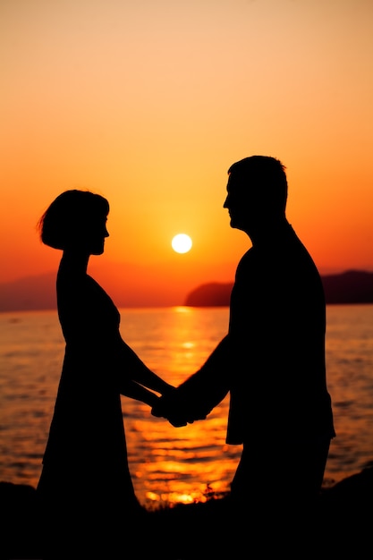 Couple in Love Silhouettes of Man and Woman during Sunset