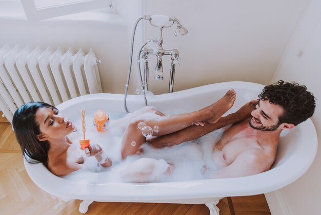 Couple in love spending time together in the house. Romantic moments in the bathroom